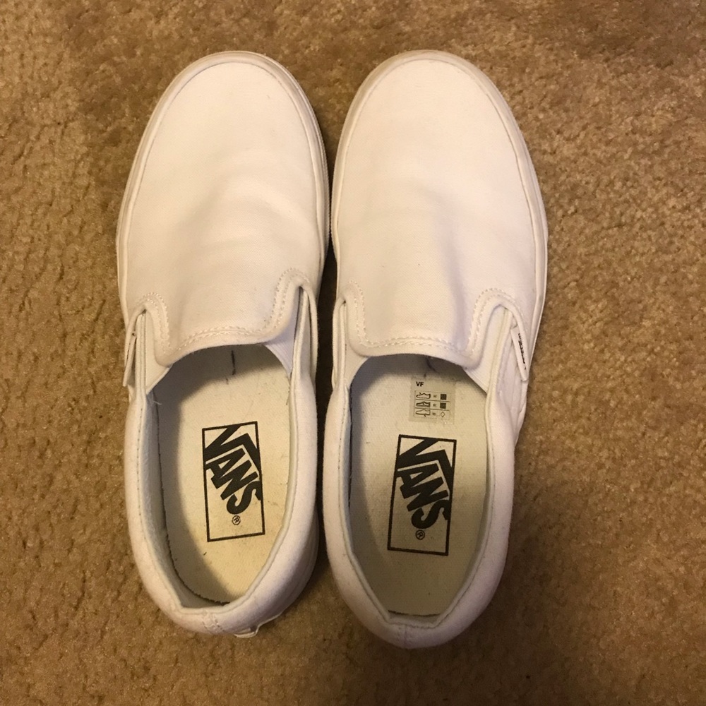 All white slip on vans. Men’s-5. Womens-6.5.